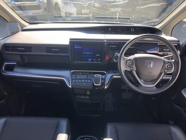 ステップワゴンスパーダ スパーダハイブリッド　Ｇ・ＥＸ　ホンダセンシング　Ｈセンシング　コンフォートビューＰＫＧ　９型ナビ　ＢＴ　ＨＤＭＩ　カープレイ　後席モニター　Ｗ温シート　わくわくゲート　１タッチＷパワスラ　ＬＥＤオートライト・フォグ　前後ドラレコ　ステアＳＷ　ＥＴＣ（3枚目）
