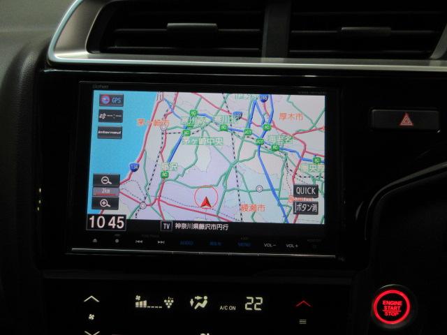 フィット 13G・Lホンダセンシング HondaSENSING メモリーナビ リアカメラ ETC LEDヘッドライト・フォグライト オートライト Bluetooth USB ドアバイザー ワンオーナー 地デジフルセグTV 車線逸脱警報装置(3枚目)
