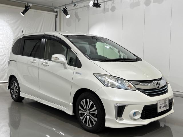 フリードハイブリッド ジャストセレクション 禁煙車 ワンオーナー 純正メモリーナビ リア席モニター リアカメラ 両側電動スライドドア 純正アルミホイール スマートキー ETC コンフォートビューパッケージ クルコン 本革巻ステアリングホイール(6枚目)