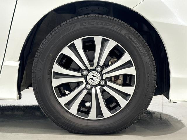 フリードハイブリッド ジャストセレクション 禁煙車 ワンオーナー 純正メモリーナビ リア席モニター リアカメラ 両側電動スライドドア 純正アルミホイール スマートキー ETC コンフォートビューパッケージ クルコン 本革巻ステアリングホイール(11枚目)