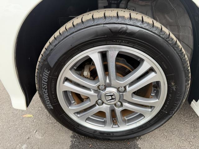 N-BOXカスタム G・Lパッケージ ワンオーナー・7インチ純ナビTV・Rカメラ・左パワスラ・HID・オートライト アイドリングストップ車 1オーナー ナビ・TV スマキ- フロントベンチシート 両側スライドドア パワーウィンドウ ABS(64枚目)