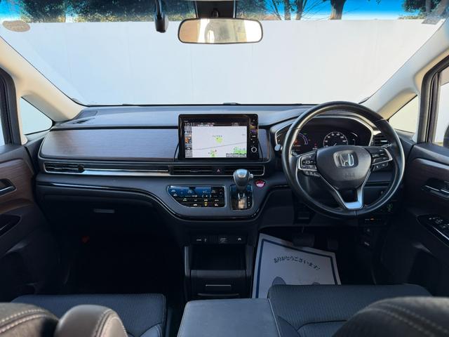 オデッセイハイブリッド ｅ：ＨＥＶアブソルート・ＥＸ　１０インチ純ナビ・Ｂｌｕｅｔｏｏｔｈ・ドラレコ・障害物センサー・シートヒーター・オットマン・インターナビ・ＬＥＤ・ＥＴＣ　ＬＥＤライト　シ－トヒ－タ－　両側ＰＳＤ　整備記録簿　フルセグ　ＤＶＤ再生機能（10枚目）