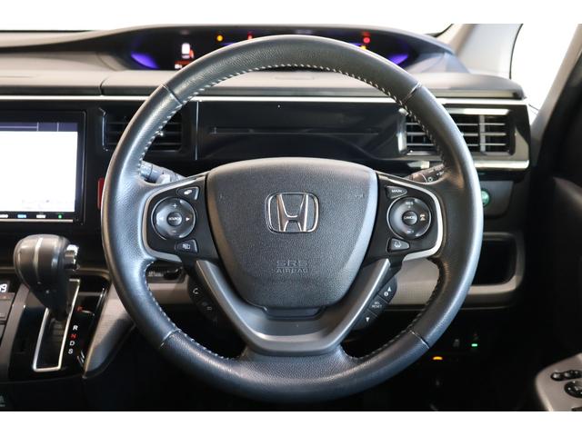 ステップワゴンスパーダ スパーダホンダセンシング 純正Mナビ 後席モニター ドラレコ 盗難防止 助手席エアバッグ ワンオーナ- Wパワスラ 記録簿有 地デジ サイドエアバッグ LEDライト 横滑り防止システム オートエアコン リアカメラ ナビ&TV(17枚目)