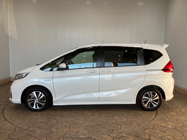 フリードハイブリッド ハイブリッド・EX 前ドラレコ ホンダセンシング メモリーナビ ETC 地デジフルセグTV シ-トヒ-タ- リヤカメラ LEDライト フルオートエアコン ABS DVD再生可 サイドエアバッグ キーフリー ナビ&TV(12枚目)