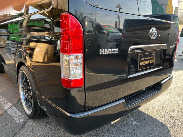 ハイエースバン スーパーGL ダークプライムII 5型ディーゼル グラインドタトゥー施工 ローダウン 20インチアルミホイール 社外ナビ ETC モデリスタスポイラー 電動スライドドア Rフィルム LED室内灯 トヨタセーフティセンス スマートキー(49枚目)