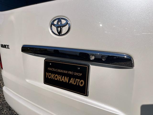 ハイエースワゴン ＧＬ　５型　ワンオーナー　社外ナビＴＶ　電動スライドドア　フローリング加工　ローダウン　４列目ベッドキット　モデリスタエアロ　シートカバー　リアフィルム　後席モニター　バックカメラ　ＥＴＣ（52枚目）