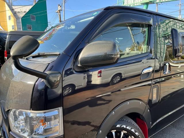 ハイエースバン スーパーＧＬ　ダークプライム　４型　ディーゼル　社外ナビ　ベッドキット　内装カスタム　ソーラーパネル　サブバッテリー　ＦＦヒーター　レカロシート　オーリンズＲサス　足回り改　バッドフェイス　２インチダウン　スライド式セカンドシート（41枚目）