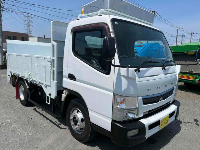 キャンター 垂直パワーゲート付４．２ｔ積ワイドセミロング平ボディー５ＭＴ　４．２ｔ積ワイドセミロング平ボディー　５速ＭＴ　車検Ｒ８年５月１３日　荷台内寸長３３９幅２１０高６０ｃｍ　床面鉄板敷き　３方開　楽々ゲート付　新明和製垂直パワーゲート付　車両総重量７９７５キロ（21枚目）