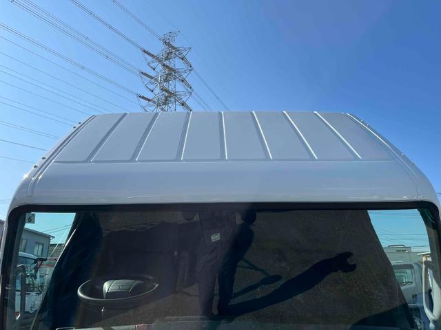 キャンター 格納ゲート付ワイドロング２ｔ積アルミバン　５速ＭＴ　ワイドロング２ｔ積アルミバン　５速ＭＴ　助手席側サイド扉付　リヤ観音開き　荷台内寸長４５０幅２０８高２０７ｃｍ　荷室床面鉄板敷き　ラッシングレール２段　パブコ製格納パワーゲート付　昇降能力１０００キロ（38枚目）
