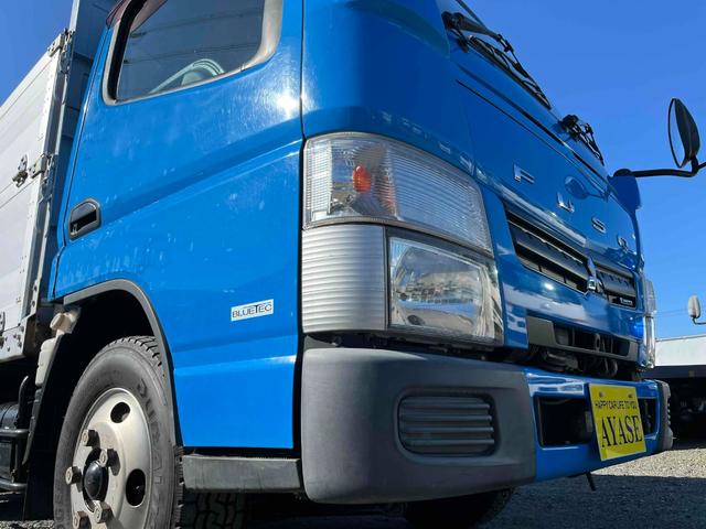 キャンター 垂直ゲート付２ｔ積み平アルミブロック　ガス屋仕様５方開アオリ　２ｔ積アルミブロック平ボディー　５速ＭＴ　上下前後分割５方開アオリ　中間支柱脱着可　荷台内寸長３１５幅１６８高１１１ｃｍ　新明和製垂直パワーゲート付　　タイヤ山８分　車両総重量５１１５キロ（26枚目）