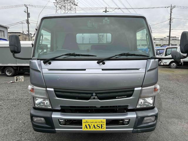 キャンター ２．６ｔ積プレス式パッカー車　新明和７．４立米　２．６ｔ積プレス式パッカー車　５速ＭＴ　ＥＴＣ　バックカメラ付　新明和製Ｇ－ＰＸ　タンク床面ステンレス　容積７．４立米　連続スイッチ　ステンレス汚水タンク　コンテナ反転装置付　車両総重量７９８５ｋｇ（2枚目）