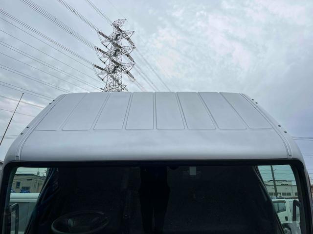 キャンター ２．６ｔ積プレス式パッカー車　新明和７．４立米　２．６ｔ積プレス式パッカー車　５速ＭＴ　ＥＴＣ　バックカメラ付　新明和製Ｇ－ＰＸ　タンク床面ステンレス　容積７．４立米　連続スイッチ　ステンレス汚水タンク　コンテナ反転装置付　車両総重量７９８５ｋｇ（46枚目）