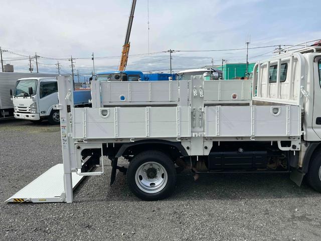 ダイナトラック 垂直ゲート付3t積ガス屋仕様平ボディー 分割5方開アオリ 3t積み平床ボディー 5速MT 全低床 ルーフキャリア付 前後上下分割式ガス屋仕様アオリ 荷台床面鉄板敷き 荷台内寸長315幅161高78cm 新明和製垂直パワーゲート付 車両総重量5985キロ(28枚目)