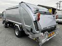 キャンター ２．６ｔ積プレス式パッカー車　新明和７．４立米　２．６ｔ積プレス式パッカー車　５速ＭＴ　ＥＴＣ　バックカメラ付　新明和製Ｇ－ＰＸ　タンク床面ステンレス　容積７．４立米　連続スイッチ　ステンレス汚水タンク　コンテナ反転装置付　車両総重量７９８５ｋｇ（4枚目）