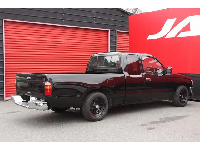 ハイラックススポーツピック エクストラキャブ　ローダウンブロック　デイトナブラックホイール　リアステップバンパー　社外グリル　社外オーディオ　ＥＴＣ　４速ＡＴ　積載量２５０キロ（35枚目）