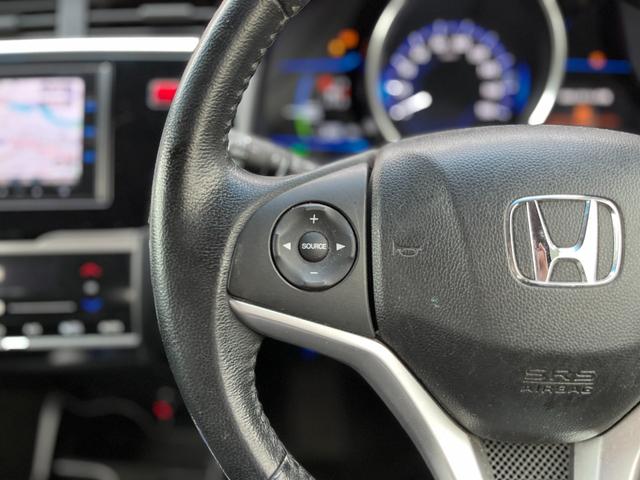 フィットハイブリッド Ｆパッケージ　ワンオーナー　クルコン　ナビ　フルセグＴＶ　ＤＶＤ再生　Ｂｌｕｅｔｏｏｔｈオーディオ　ミュージックラック　ステリモ　バックカメラ　ＥＴＣ　ドラレコ　スマートキープッシュスタート　ＬＥＤオートライト（9枚目）