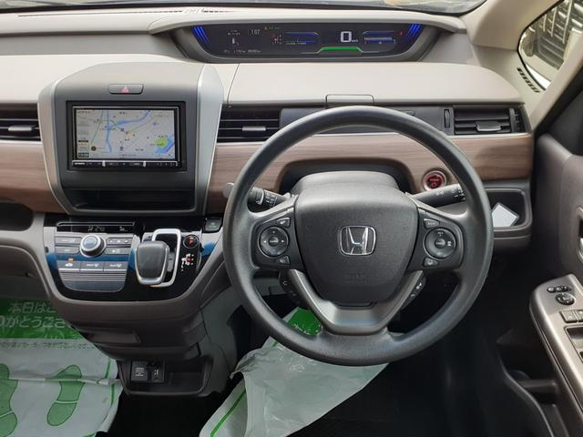 フリードハイブリッド ハイブリッド・Ｇホンダセンシング　禁煙車　後期型　両側電動スライドドア　Ａクルコン　ＥＴＣ　ＬＥＤヘッドライト　プッシュスタート　オートエアコン　社外ナビ　Ｂｌｕｅｔｏｏｔｈ　ＤＶＤ再生　ＳＤ　ＵＳＢ　バックカメラ　除菌　サンシェード（73枚目）