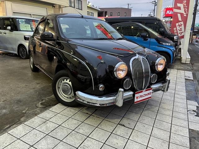 ビュート 12ST 光岡車☆オプション専用ウッド×赤革インパネ☆ストラーダSDナビ☆フルセグTV☆DVD再生☆ルームミラー型前後ドラレコ☆ETC☆赤革シートカバー☆禁煙車☆キーレスキー☆(5枚目)