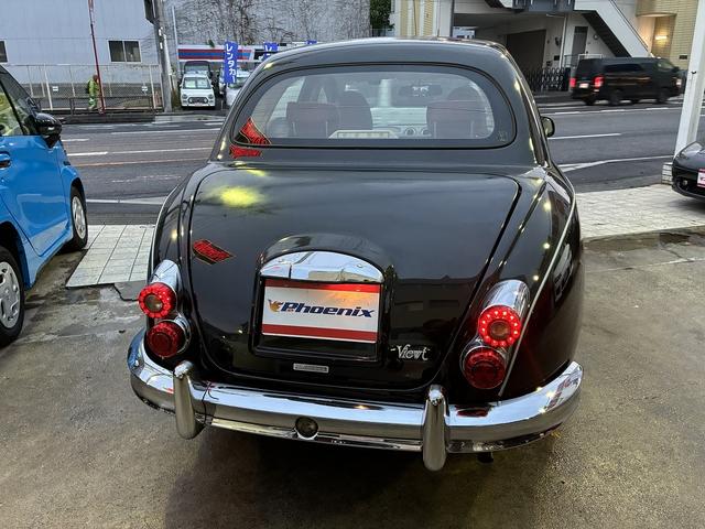 ビュート 12ST 光岡車☆オプション専用ウッド×赤革インパネ☆ストラーダSDナビ☆フルセグTV☆DVD再生☆ルームミラー型前後ドラレコ☆ETC☆赤革シートカバー☆禁煙車☆キーレスキー☆(8枚目)