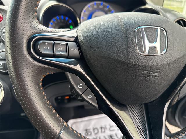フィットシャトルハイブリッド ハイブリッド・ナビプレミアムセレクション　禁煙車　ＨＤＤナビ　バックカメラ　ワンセグ　ＤＶＤ　ハーフレザーシート　ＨＩＤ　ＥＴＣ　クルーズコントロール　横滑り防止装置　スマートキー　社外１５インチＡＷ　タイミングチェーン（16枚目）