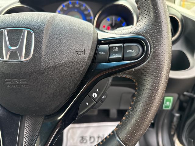 フィットシャトルハイブリッド ハイブリッド・ナビプレミアムセレクション　禁煙車　ＨＤＤナビ　バックカメラ　ワンセグ　ＤＶＤ　ハーフレザーシート　ＨＩＤ　ＥＴＣ　クルーズコントロール　横滑り防止装置　スマートキー　社外１５インチＡＷ　タイミングチェーン（17枚目）