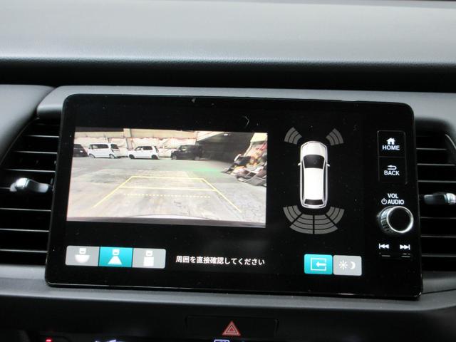 フィット e:HEVホーム20周年特別仕様車カーサ HondaSENSING 前後ドラレコ メモリーナビ リアカメラ シートヒーター ETC 純正アルミ Bluetooth ドアバイザー ワンオーナー LKAS BT接続 電動格納ミラー 横滑り防止装置(4枚目)