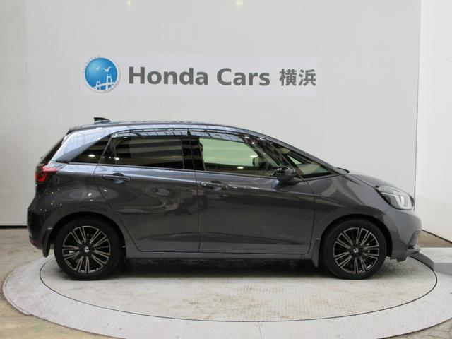 フィット e:HEVホーム20周年特別仕様車カーサ HondaSENSING 前後ドラレコ メモリーナビ リアカメラ シートヒーター ETC 純正アルミ Bluetooth ドアバイザー ワンオーナー LKAS BT接続 電動格納ミラー 横滑り防止装置(25枚目)