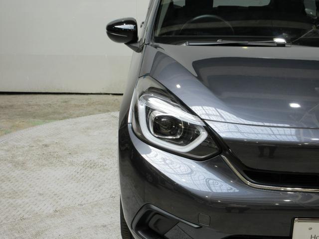 フィット e:HEVホーム20周年特別仕様車カーサ HondaSENSING 前後ドラレコ メモリーナビ リアカメラ シートヒーター ETC 純正アルミ Bluetooth ドアバイザー ワンオーナー LKAS BT接続 電動格納ミラー 横滑り防止装置(28枚目)