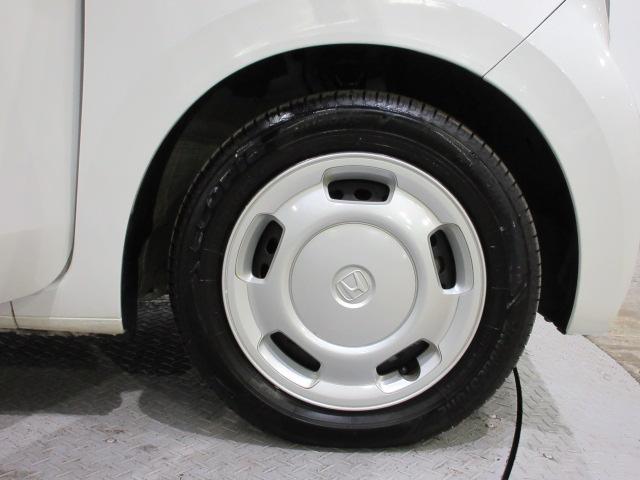 １５５−６５−１４タイヤと専用のホイールキャップです。