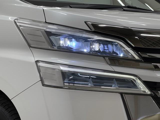 ヴェルファイア 2.5X ワンセグ LEDヘッドライト クルーズコントロール フルフラット AUX ETC 横滑り防止装置 記録簿 3列シート 盗難防止装置 オ-トエアコン メモリーナビ アルミホイール Wエアコン ABS(18枚目)