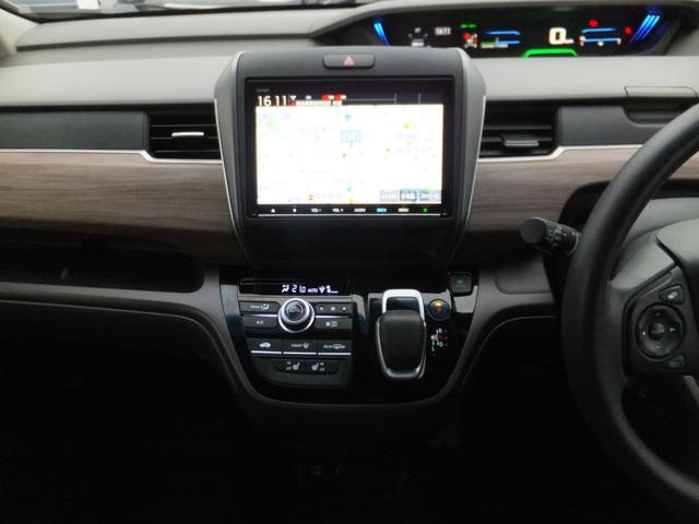 フリード+ハイブリッド ハイブリッドG・ホンダセンシング ホンダセンシング/純正9型ナビ/CD/DVD/フルセグ/Bluetooth/ETC/Bカメラ/前後ドラレコ/両自動/クルコン/LEDライト/シートヒーター/社外アルミ/ルーフラック/ワンオーナー/(30枚目)