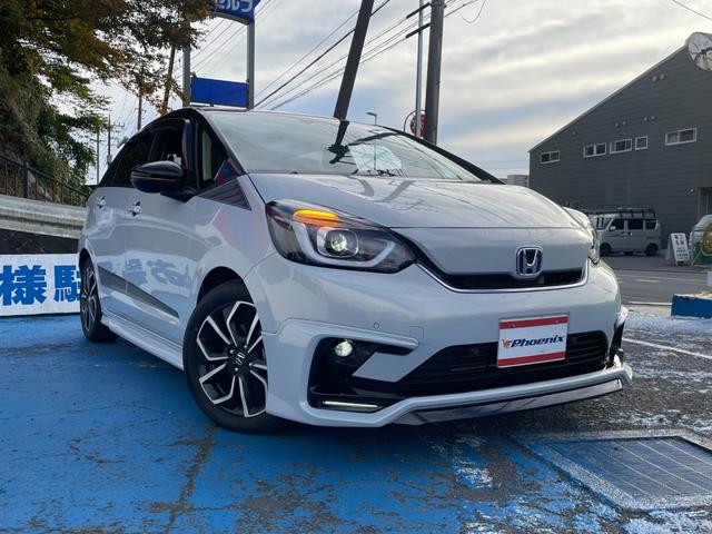 フィット ｅ：ＨＥＶホーム　無限フルエアロ＆ＬＥＤデイライト＆マフラー＆デカールセット　２トーン　コンフォートビューＰＫＧ　純正９インチナビ　バックカメラ　フルセグ　ＤＶＤ　ＢＴ　前後ドラレコ　ＥＴＣ　クリアランスソナー　禁煙車（6枚目）