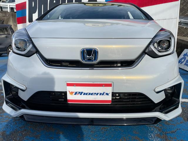 フィット ｅ：ＨＥＶホーム　無限フルエアロ＆ＬＥＤデイライト＆マフラー＆デカールセット　２トーン　コンフォートビューＰＫＧ　純正９インチナビ　バックカメラ　フルセグ　ＤＶＤ　ＢＴ　前後ドラレコ　ＥＴＣ　クリアランスソナー　禁煙車（24枚目）