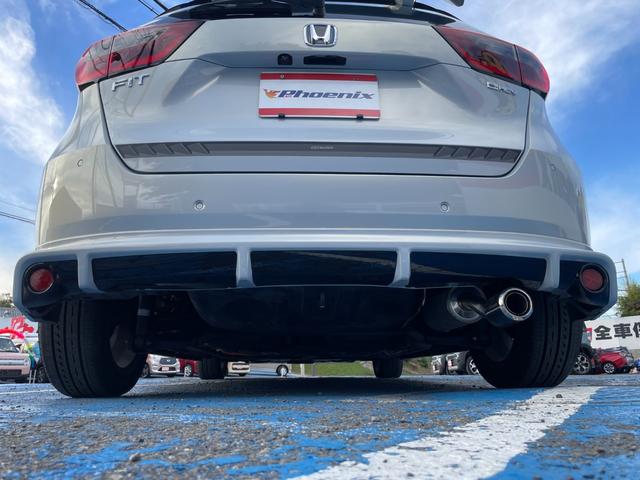 フィット ｅ：ＨＥＶホーム　無限フルエアロ＆ＬＥＤデイライト＆マフラー＆デカールセット　２トーン　コンフォートビューＰＫＧ　純正９インチナビ　バックカメラ　フルセグ　ＤＶＤ　ＢＴ　前後ドラレコ　ＥＴＣ　クリアランスソナー　禁煙車（32枚目）