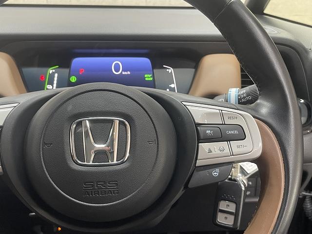 フィット e:HEVリュクス 9インチナビ 衝突被害軽減システム レーンアシスト レーダークルーズコントロール クリアランスソナー フルセグ Bluetooth Bカメラ ETC スマートキー 純正ドラレコ ハンドルヒーター(25枚目)