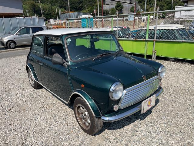 MINI スプライトi マニュアル4速車 屋根付き車庫保管 長期前オーナー使用者 アルミ 同色オーバーフェンダー エアコン ETC 革巻きステアリング(6枚目)