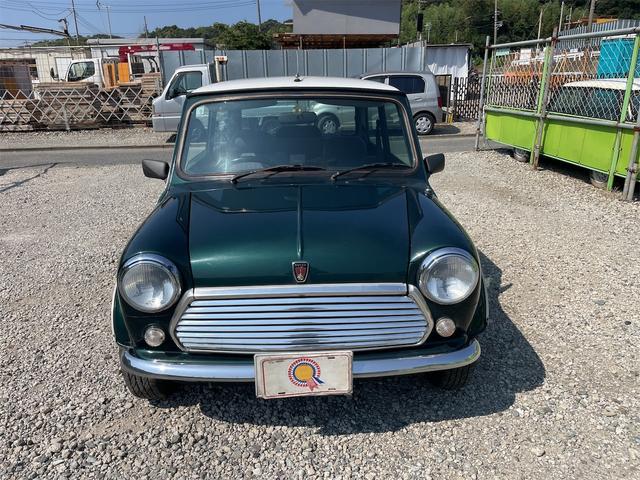 MINI スプライトi マニュアル4速車 屋根付き車庫保管 長期前オーナー使用者 アルミ 同色オーバーフェンダー エアコン ETC 革巻きステアリング(7枚目)