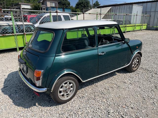 MINI スプライトi マニュアル4速車 屋根付き車庫保管 長期前オーナー使用者 アルミ 同色オーバーフェンダー エアコン ETC 革巻きステアリング(9枚目)