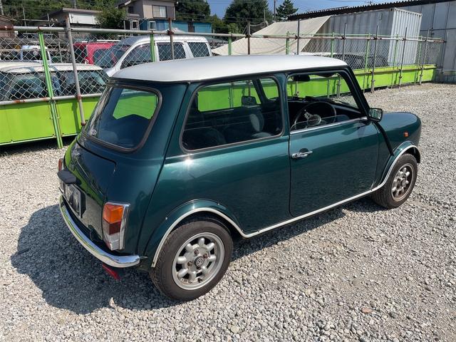 MINI スプライトi マニュアル4速車 屋根付き車庫保管 長期前オーナー使用者 アルミ 同色オーバーフェンダー エアコン ETC 革巻きステアリング(17枚目)