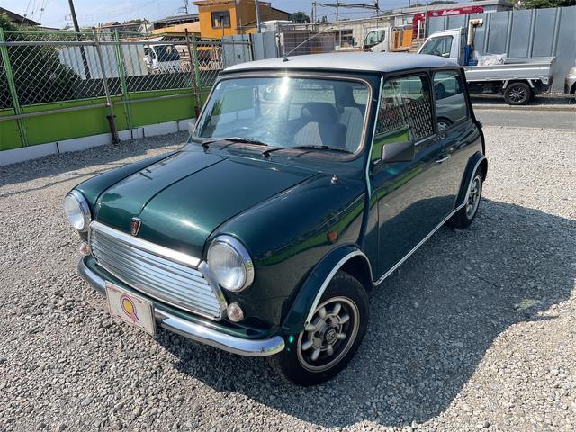 MINI スプライトi マニュアル4速車 屋根付き車庫保管 長期前オーナー使用者 アルミ 同色オーバーフェンダー エアコン ETC 革巻きステアリング(18枚目)