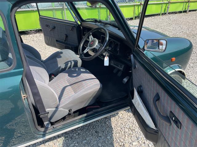 MINI スプライトi マニュアル4速車 屋根付き車庫保管 長期前オーナー使用者 アルミ 同色オーバーフェンダー エアコン ETC 革巻きステアリング(21枚目)