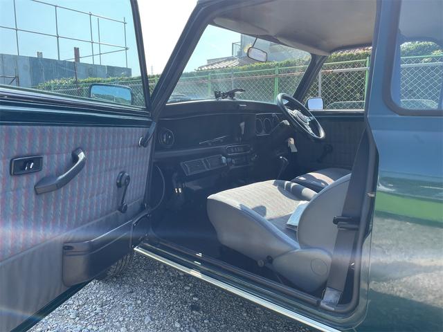 MINI スプライトi マニュアル4速車 屋根付き車庫保管 長期前オーナー使用者 アルミ 同色オーバーフェンダー エアコン ETC 革巻きステアリング(27枚目)