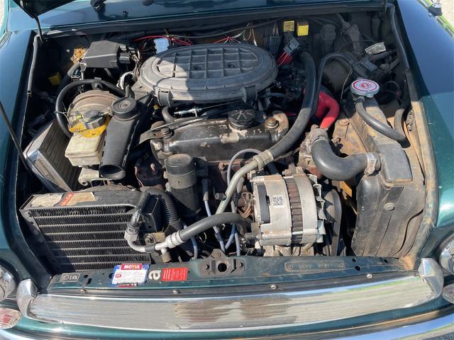 MINI スプライトi マニュアル4速車 屋根付き車庫保管 長期前オーナー使用者 アルミ 同色オーバーフェンダー エアコン ETC 革巻きステアリング(34枚目)