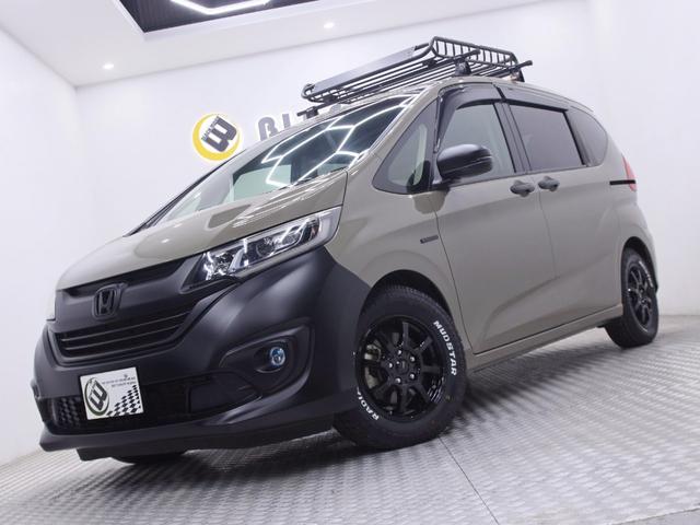 フリードハイブリッド ハイブリッド・EX オリジナルアウトドアカスタム ホンダセンシング ハーフレザー 新品ホイール/タイヤ/ルーフキャリア・ラック 両側電動スライドドア 純正メモリーナビ バックカメラ フリップダウンモニター シートヒーター(5枚目)