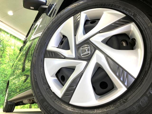 フリードハイブリッド ハイブリッド・Ｇホンダセンシング　純正９型ナビ　両側電動ドア　バックカメラ　衝突被害軽減システム　レーダークルーズ　禁煙車　スマートキー　ＬＥＤヘッド　ビルトインＥＴＣ　車線逸脱警報　オートライト　オートエアコン　アイドリングストップ（14枚目）