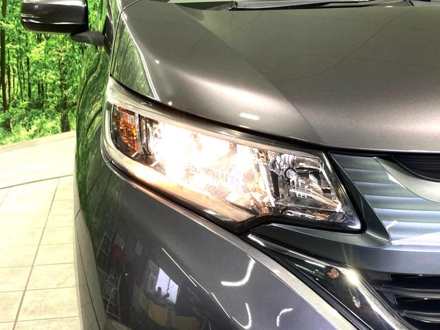 フリード G・ホンダセンシング 禁煙車 純正SDナビ 両側電動ドア 衝突軽減 アダプティブクルーズコントロール 車線逸脱警告 オートエアコン 横滑り防止 プライバシーガラス ETC バックカメラ スマートキー(11枚目)