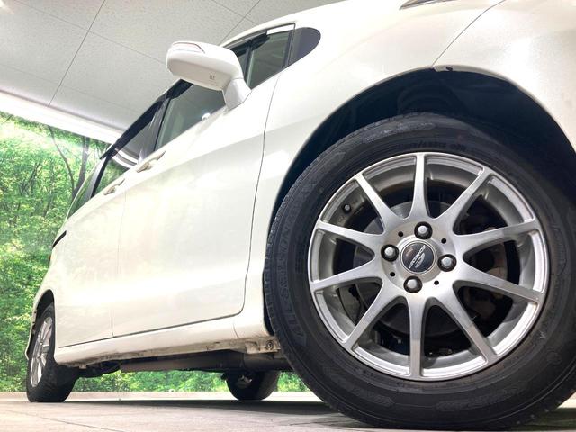 フリード G ジャストセレクション 電動スライドドア 純正SDナビ 禁煙車 HIDヘッド ETC オートライト オートエアコン 電動格納ドアミラー ドアバイザー プライバシーガラス(14枚目)