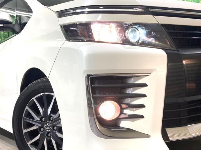 ヴォクシー ZS サンルーフ 両側電動ドア 純正9型ナビ 後席モニター バックカメラ 寒冷地仕様 禁煙車 スマートキー LEDヘッド ビルトインETC 純正16インチアルミ オートライト デュアルエアコン(11枚目)