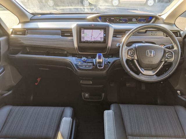 フリードハイブリッド ハイブリッド・EX Bluetooth CD DVD 前席シートヒーター レーダークルコン レーンアシスト ETC 衝突軽減ブレーキ 電動格納ミラー LEDヘッドライト オートライト 純正ナビ 両側パワースライドドア(10枚目)