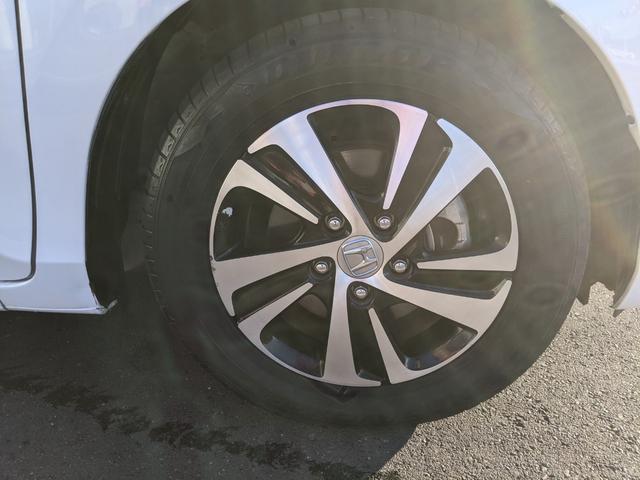 フリードハイブリッド ハイブリッド・EX Bluetooth CD DVD 前席シートヒーター レーダークルコン レーンアシスト ETC 衝突軽減ブレーキ 電動格納ミラー LEDヘッドライト オートライト 純正ナビ 両側パワースライドドア(50枚目)